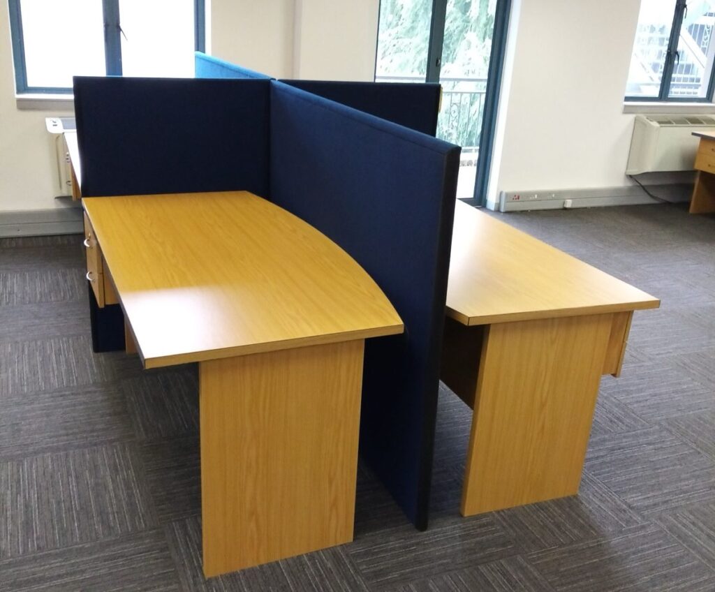 Corporate office workspace setup with desks and workstation furniture