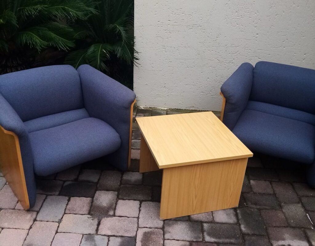 Office waiting area furniture setup with reception seating